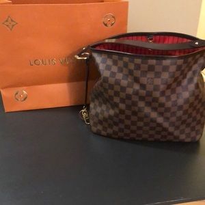 Authentic NWOT Louis Vuitton Bag.